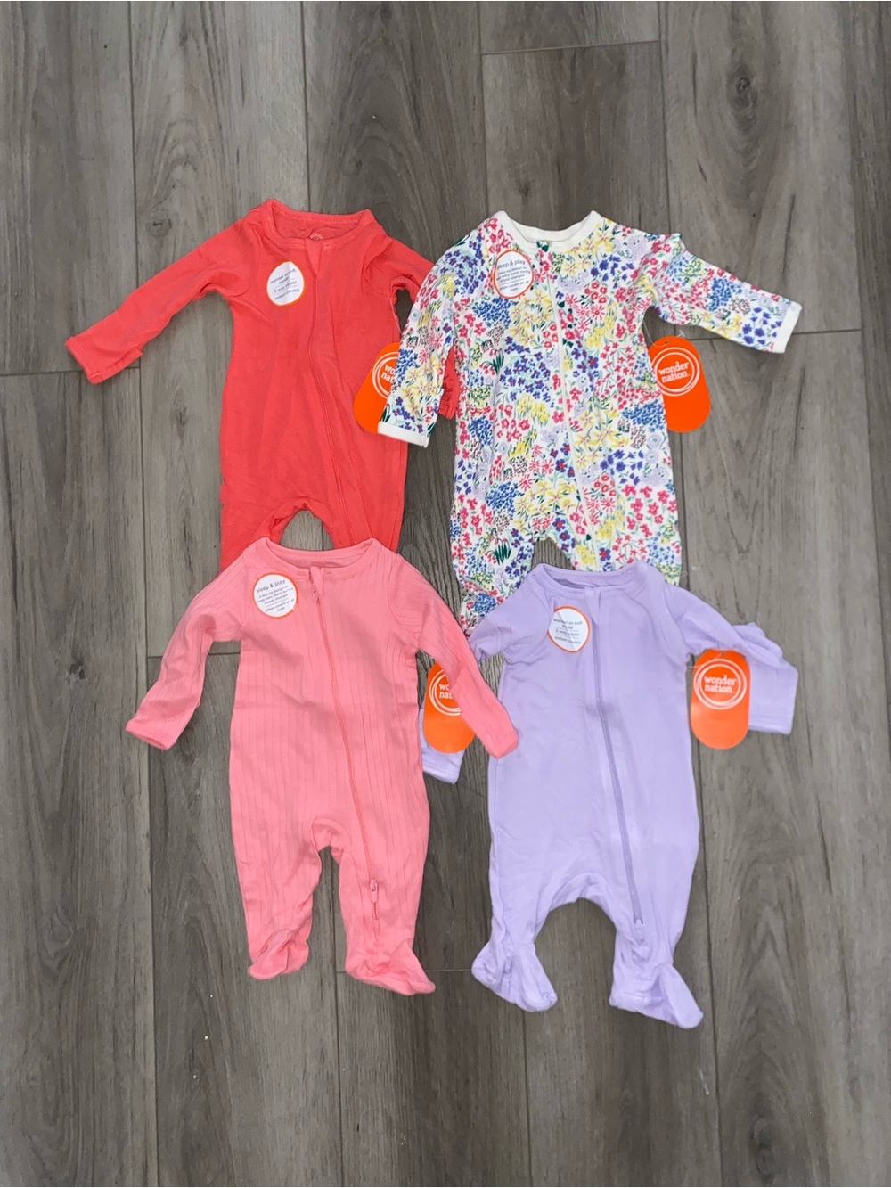 4-Pack Wonder Nation Baby One-Piece Sleepers in Coral, Pink, Purple, and Floral